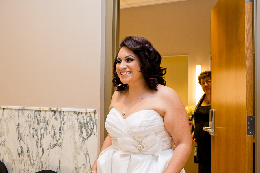 Bride is getting ready to walk down the aisle at her Santa Monica wedding. 